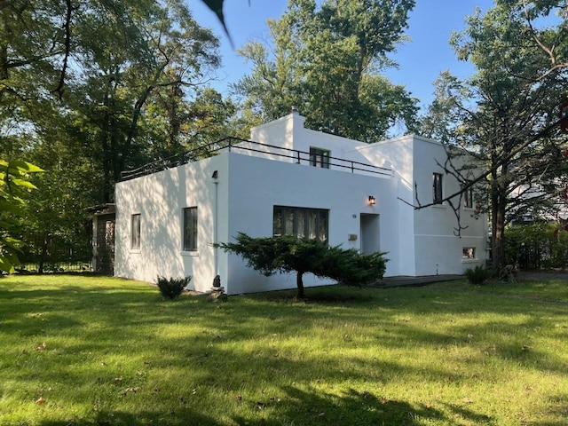 715 E Margaret St, Thornton, IL 60476 - view of property exterior with stucco siding and a yard