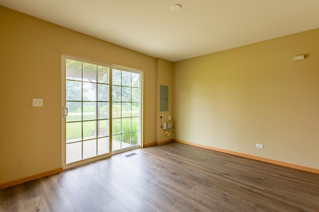 1077 Marcello Dr, Hampshire, IL 60140 - empty room with electric panel and wood finished floors