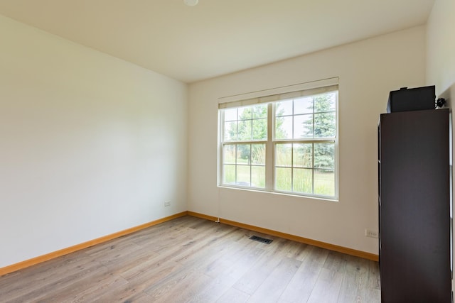 1077 Marcello Dr, Hampshire, IL 60140 - unfurnished room with baseboards and light wood-type flooring
