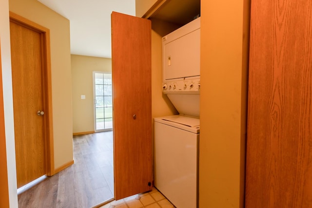 1077 Marcello Dr, Hampshire, IL 60140 - laundry area with stacked washing machine and dryer and light wood-style flooring