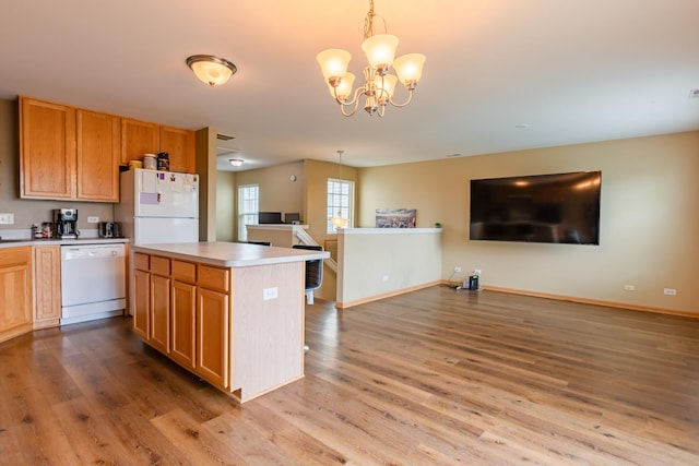1077 Marcello Dr, Hampshire, IL 60140 - kitchen featuring white appliances, open floor plan, light wood finished floors, and a chandelier