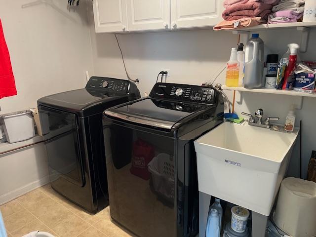 1312 Frederick Ln, Naperville, IL 60565 - laundry room featuring washing machine and clothes dryer, cabinet space, and light tile patterned floors