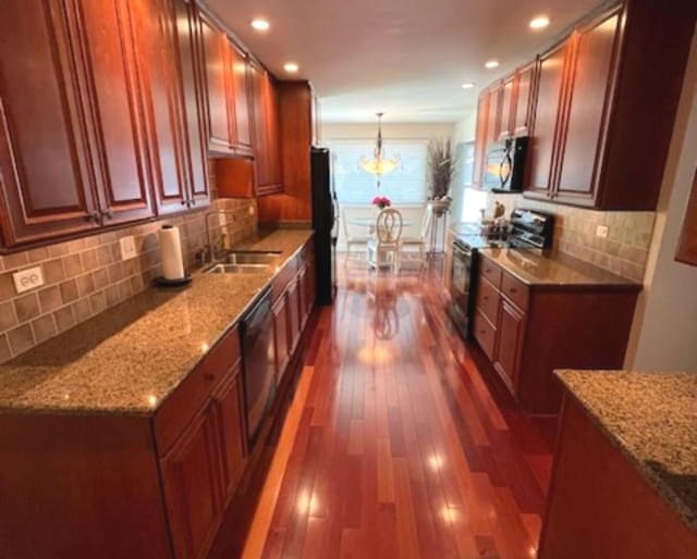1312 Frederick Ln, Naperville, IL 60565 - kitchen with electric range, dark wood-type flooring, freestanding refrigerator, pendant lighting, and tasteful backsplash