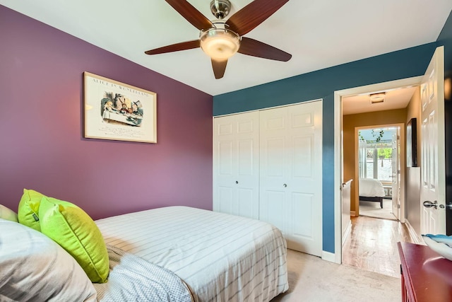 5404 N Hoyne Ave Unit 5404, Chicago, IL 60625 - bedroom featuring a closet, light colored carpet, and a ceiling fan