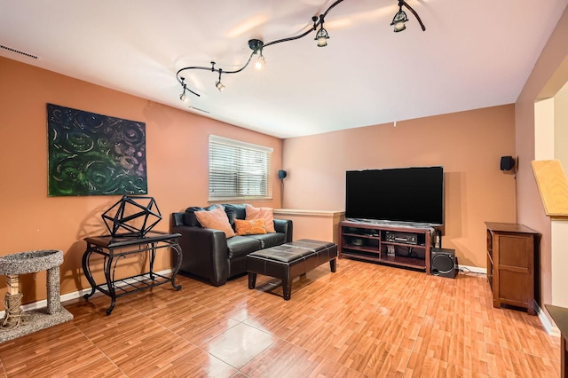 5404 N Hoyne Ave Unit 5404, Chicago, IL 60625 - living room featuring light wood finished floors and rail lighting