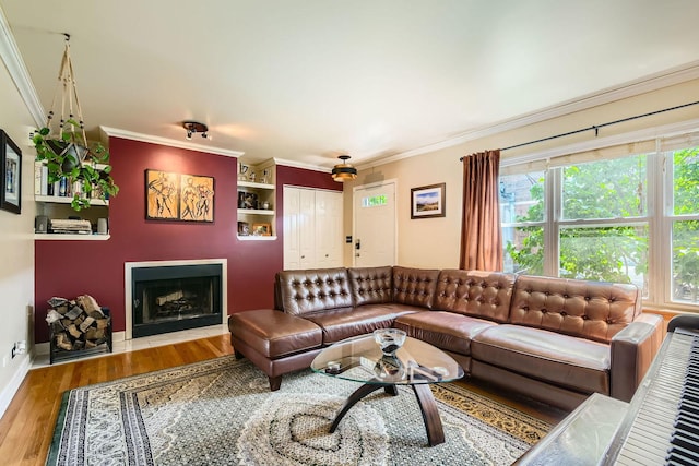 5404 N Hoyne Ave Unit 5404, Chicago, IL 60625 - living room featuring wood finished floors, crown molding, and a fireplace with flush hearth