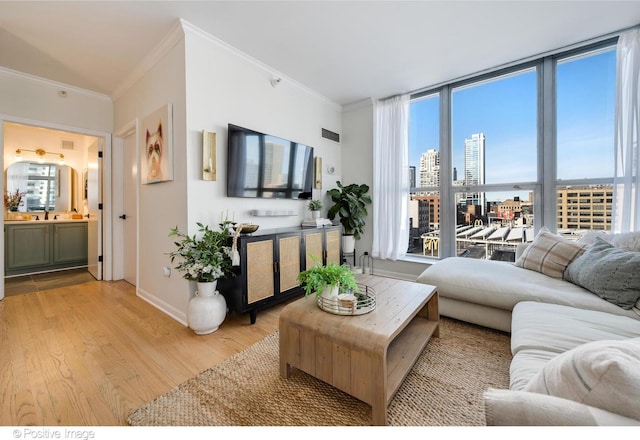 600 N Dearborn St Unit 701, Chicago, IL 60654 - living room with crown molding and light wood finished floors