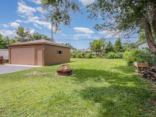 316 S Park St, Westmont, IL 60559 - view of yard featuring an outdoor fire pit, an outbuilding, and a detached garage