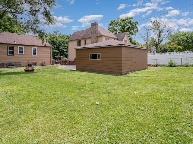 316 S Park St, Westmont, IL 60559 - fenced backyard with an outdoor fire pit and an outbuilding