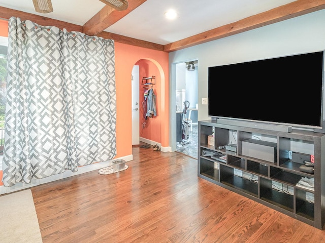 316 S Park St, Westmont, IL 60559 - unfurnished living room with arched walkways, beam ceiling, and wood finished floors