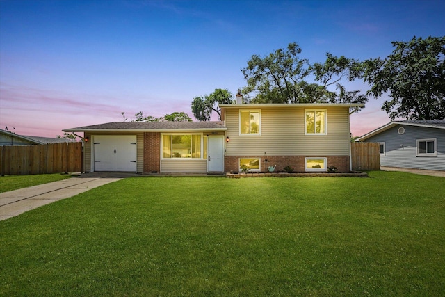 9451 Elm Ave, Mokena, IL 60448 - split level home featuring concrete driveway, an attached garage, and brick siding