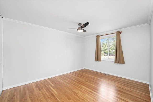 9451 Elm Ave, Mokena, IL 60448 - unfurnished room featuring light wood-style flooring, ornamental molding, and ceiling fan