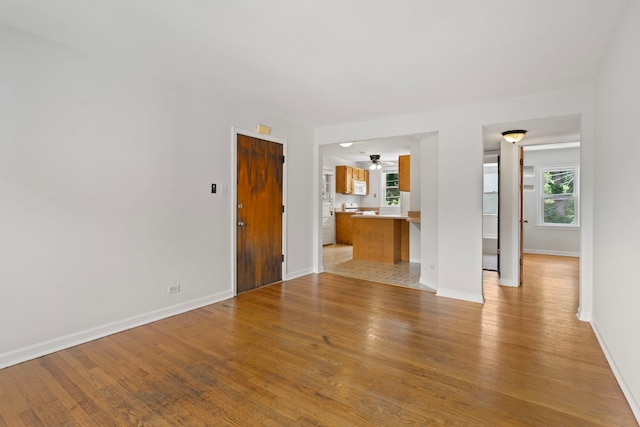 10410 S Walden Pkwy Unit 2N, Chicago, IL 60643 - unfurnished living room featuring light wood-style floors and ceiling fan