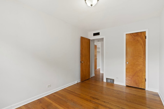 10410 S Walden Pkwy Unit 2N, Chicago, IL 60643 - unfurnished bedroom with wood finished floors and baseboards