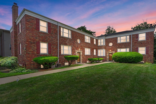 10410 S Walden Pkwy Unit 2N, Chicago, IL 60643 - townhome / multi-family property featuring a chimney, a yard, and brick siding