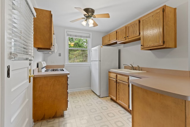 10410 S Walden Pkwy Unit 2N, Chicago, IL 60643 - kitchen featuring white appliances, ceiling fan, light floors, light countertops, and brown cabinetry