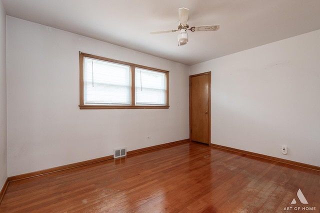 5444 S Kedvale Ave, Chicago, IL 60632 - unfurnished room with wood finished floors and a ceiling fan