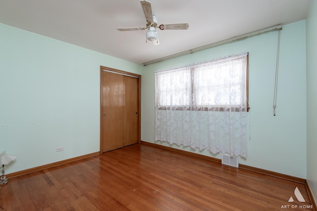 5444 S Kedvale Ave, Chicago, IL 60632 - unfurnished bedroom featuring wood finished floors, a closet, and ceiling fan