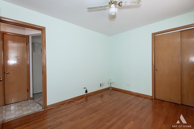 5444 S Kedvale Ave, Chicago, IL 60632 - unfurnished bedroom with wood finished floors, ceiling fan, and a closet