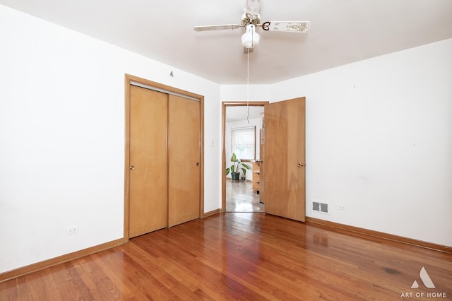 5444 S Kedvale Ave, Chicago, IL 60632 - unfurnished bedroom featuring wood finished floors, a closet, and a ceiling fan
