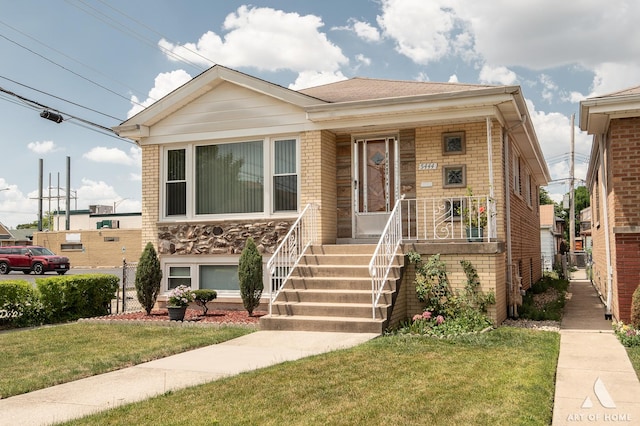 5444 S Kedvale Ave, Chicago, IL 60632 - view of front of home with a front yard, brick siding, and covered porch