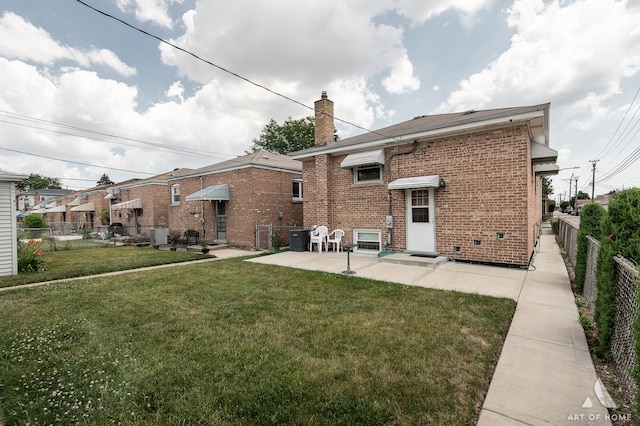 5444 S Kedvale Ave, Chicago, IL 60632 - rear view of property with brick siding, a patio, and a chimney