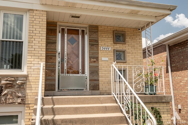 5444 S Kedvale Ave, Chicago, IL 60632 - view of exterior entry featuring brick siding and a porch