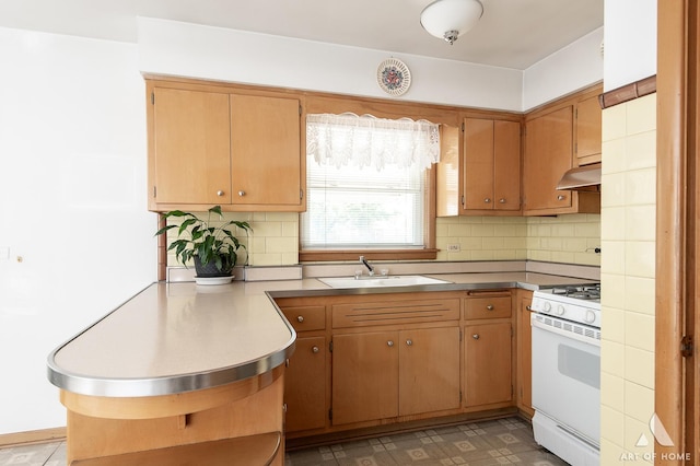 5444 S Kedvale Ave, Chicago, IL 60632 - kitchen featuring white range with gas cooktop, under cabinet range hood, backsplash, and light countertops