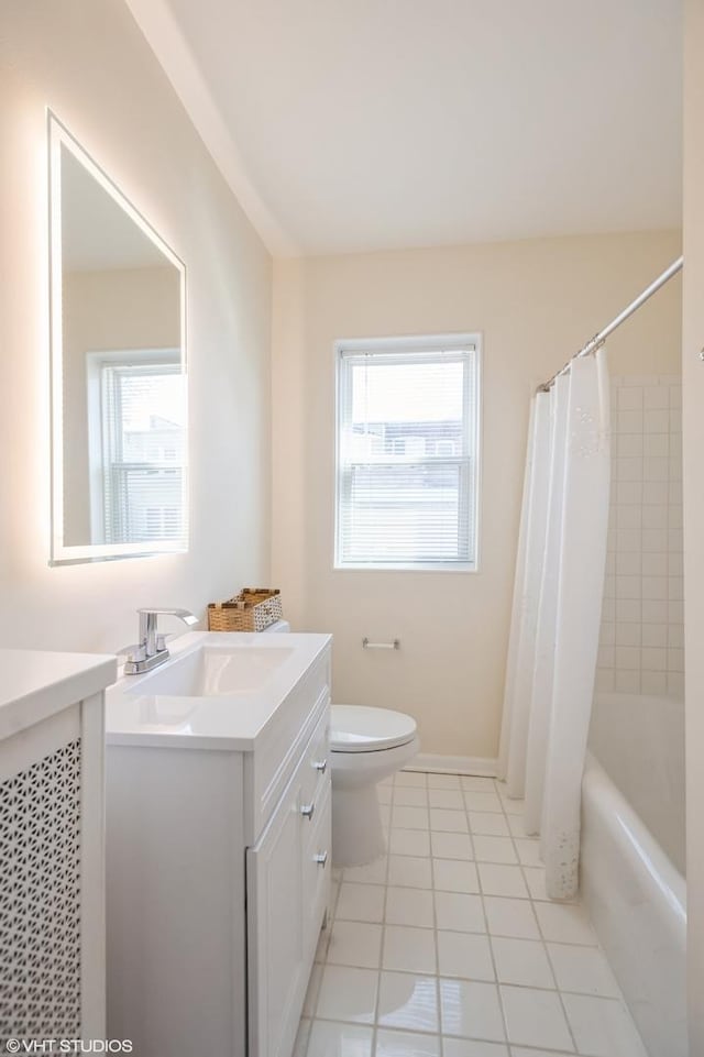 2614 W Lunt Ave, Chicago, IL 60645 - bathroom with vanity, tile patterned floors, and shower / tub combo with curtain