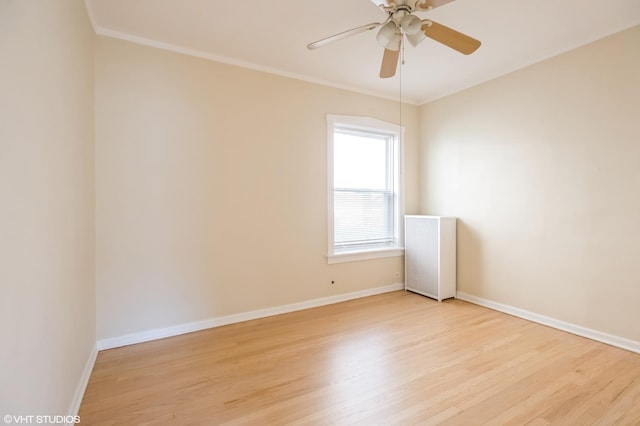 2614 W Lunt Ave, Chicago, IL 60645 - spare room with light wood-style floors, ceiling fan, ornamental molding, and radiator heating unit