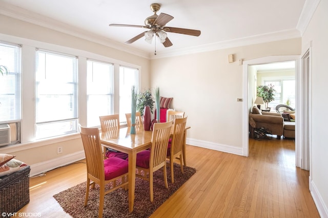 2614 W Lunt Ave, Chicago, IL 60645 - dining area featuring healthy amount of natural light, light wood-style floors, ornamental molding, a ceiling fan, and cooling unit