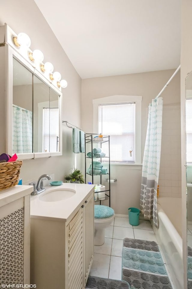 2614 W Lunt Ave, Chicago, IL 60645 - bathroom with tile patterned floors, vanity, and shower / tub combo