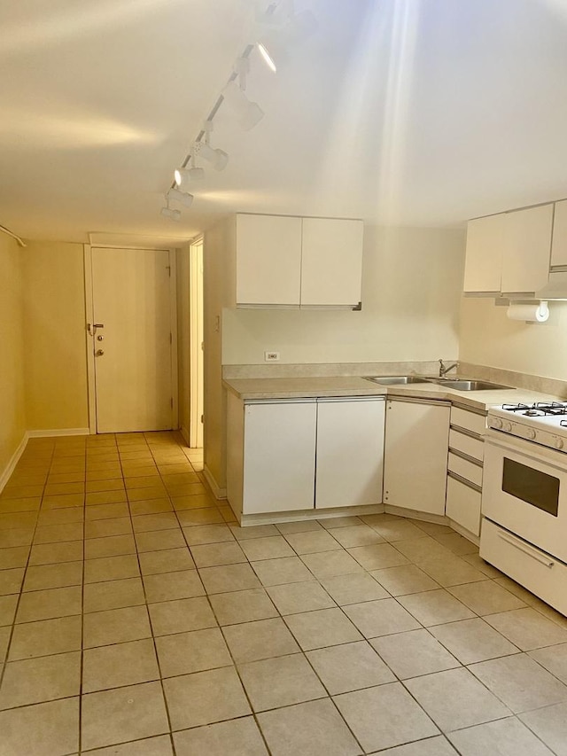 2614 W Lunt Ave, Chicago, IL 60645 - kitchen with white gas range, track lighting, light tile patterned floors, and light countertops