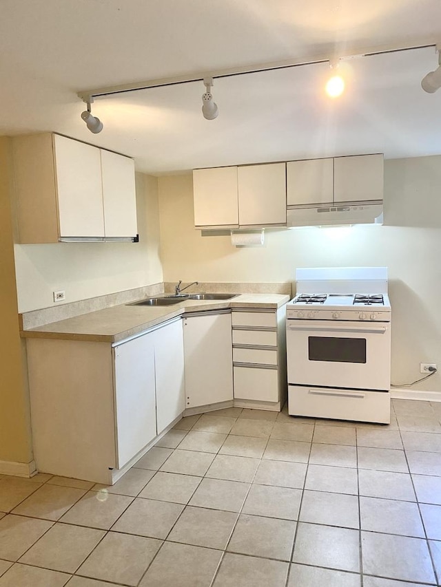 2614 W Lunt Ave, Chicago, IL 60645 - kitchen featuring white gas range, track lighting, under cabinet range hood, and light tile patterned floors