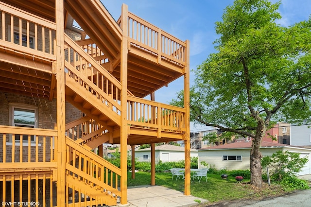 2614 W Lunt Ave, Chicago, IL 60645 - view of property exterior with stairs, a wooden deck, and a patio