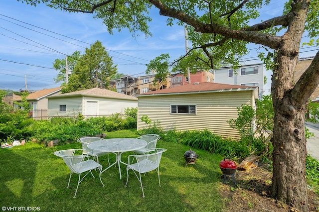 2614 W Lunt Ave, Chicago, IL 60645 - view of grassy yard featuring outdoor dining area