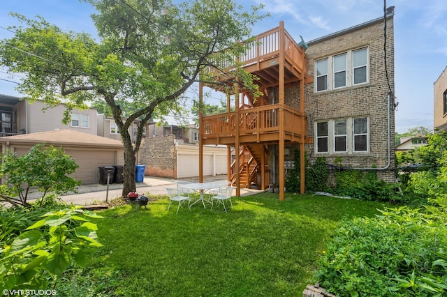 2614 W Lunt Ave, Chicago, IL 60645 - back of house featuring a garage, stairs, a yard, brick siding, and a deck