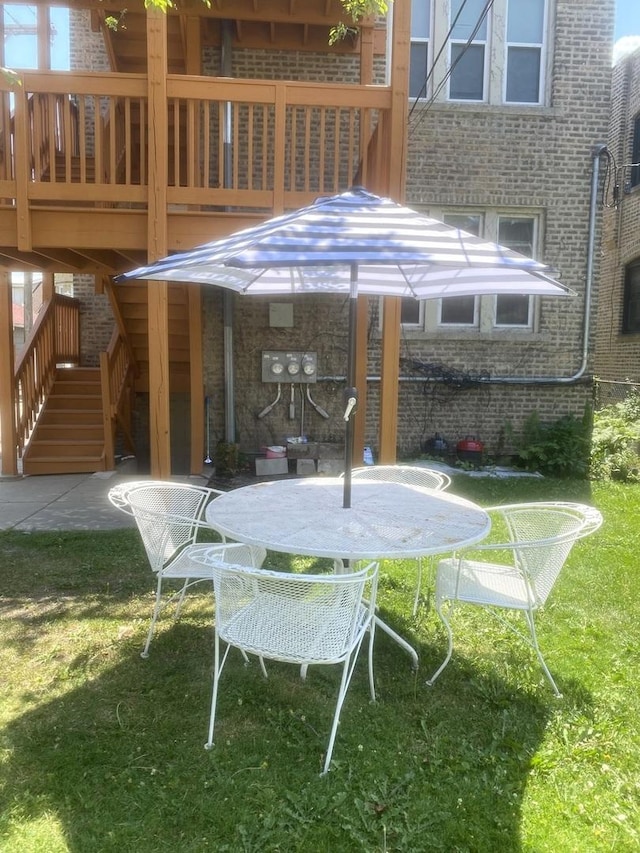 2614 W Lunt Ave, Chicago, IL 60645 - view of patio / terrace featuring stairs and outdoor dining space