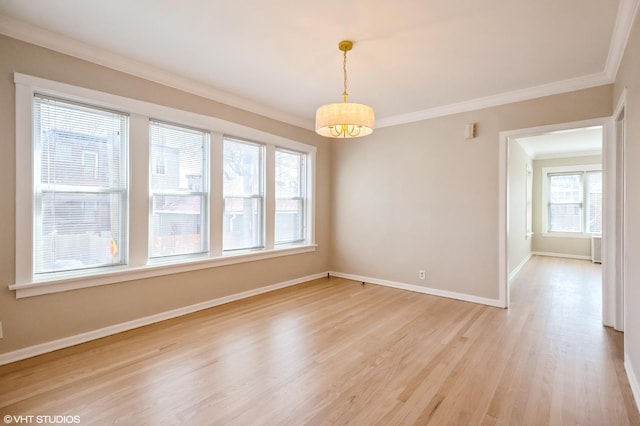 2614 W Lunt Ave, Chicago, IL 60645 - unfurnished room featuring light wood-style flooring and crown molding