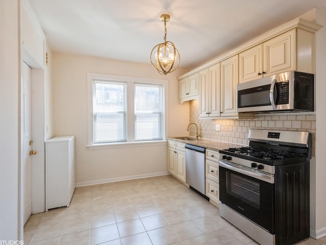 2614 W Lunt Ave, Chicago, IL 60645 - kitchen featuring stainless steel appliances, cream cabinetry, backsplash, and a chandelier