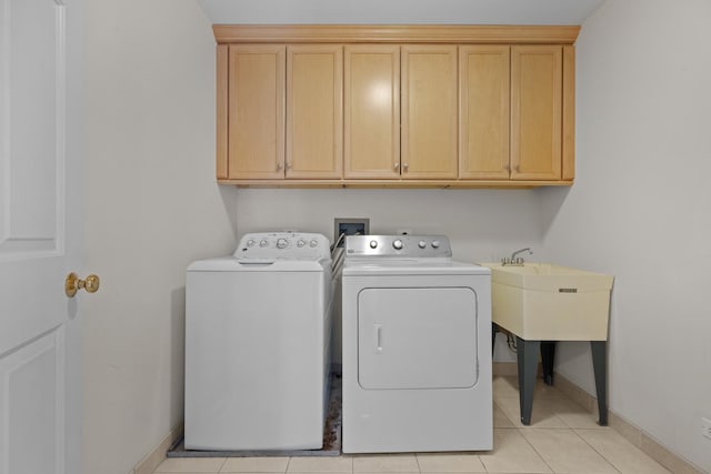 572 Stockbridge Ct, Lake Forest, IL 60045 - laundry area featuring washing machine and clothes dryer, cabinet space, and light tile patterned floors