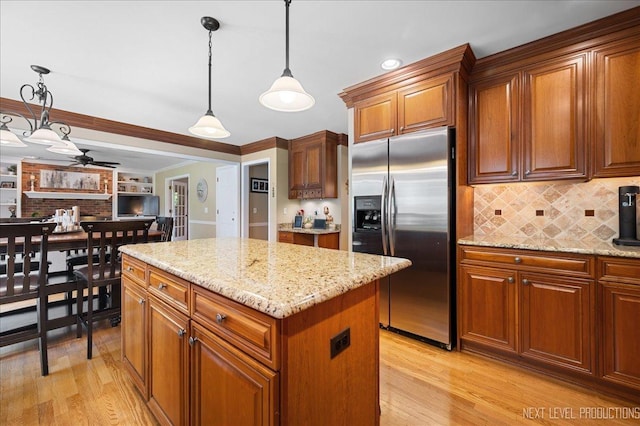 1200 Crestview Dr, Batavia, IL 60510 - kitchen with stainless steel refrigerator with ice dispenser, light wood-type flooring, ceiling fan, brown cabinets, and ornamental molding