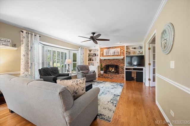 1200 Crestview Dr, Batavia, IL 60510 - living room with a ceiling fan, a fireplace, wood finished floors, ornamental molding, and built in shelves