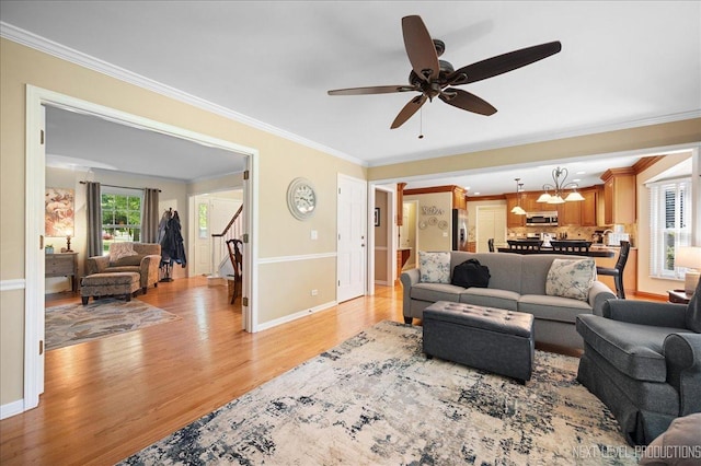 1200 Crestview Dr, Batavia, IL 60510 - living room featuring light wood-style flooring, stairs, crown molding, and a ceiling fan