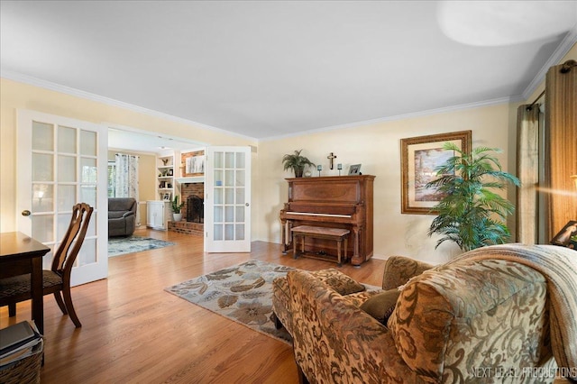 1200 Crestview Dr, Batavia, IL 60510 - living room featuring ornamental molding, wood finished floors, and a brick fireplace