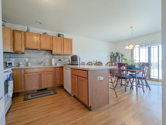 5710 Hearthside Dr, Bourbonnais, IL 60914 - kitchen featuring white appliances, light countertops, and light wood-style floors