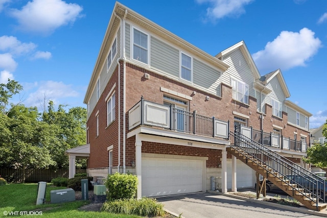 208 W Hyde St, Arlington Heights, IL 60005 - view of property with stairway, a garage, and driveway