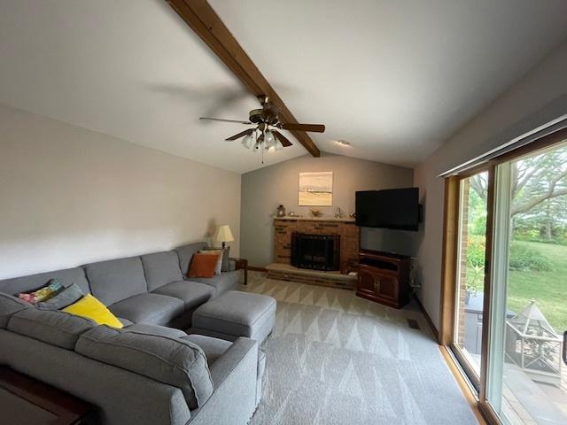 10S305 Havens Dr, Downers Grove, IL 60516 - living area featuring light carpet, a ceiling fan, and a fireplace
