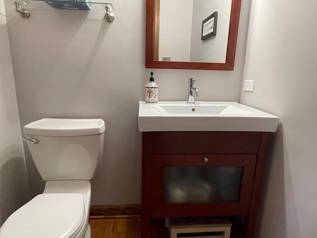 10S305 Havens Dr, Downers Grove, IL 60516 - half bathroom with vanity and wood finished floors