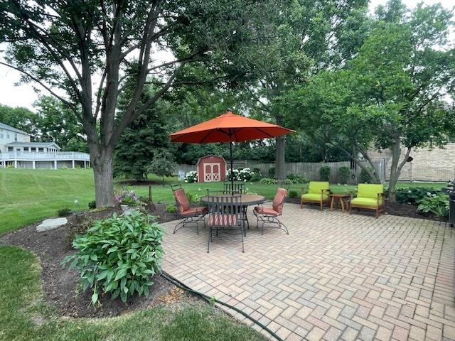 10S305 Havens Dr, Downers Grove, IL 60516 - view of patio / terrace featuring a storage unit and outdoor dining area